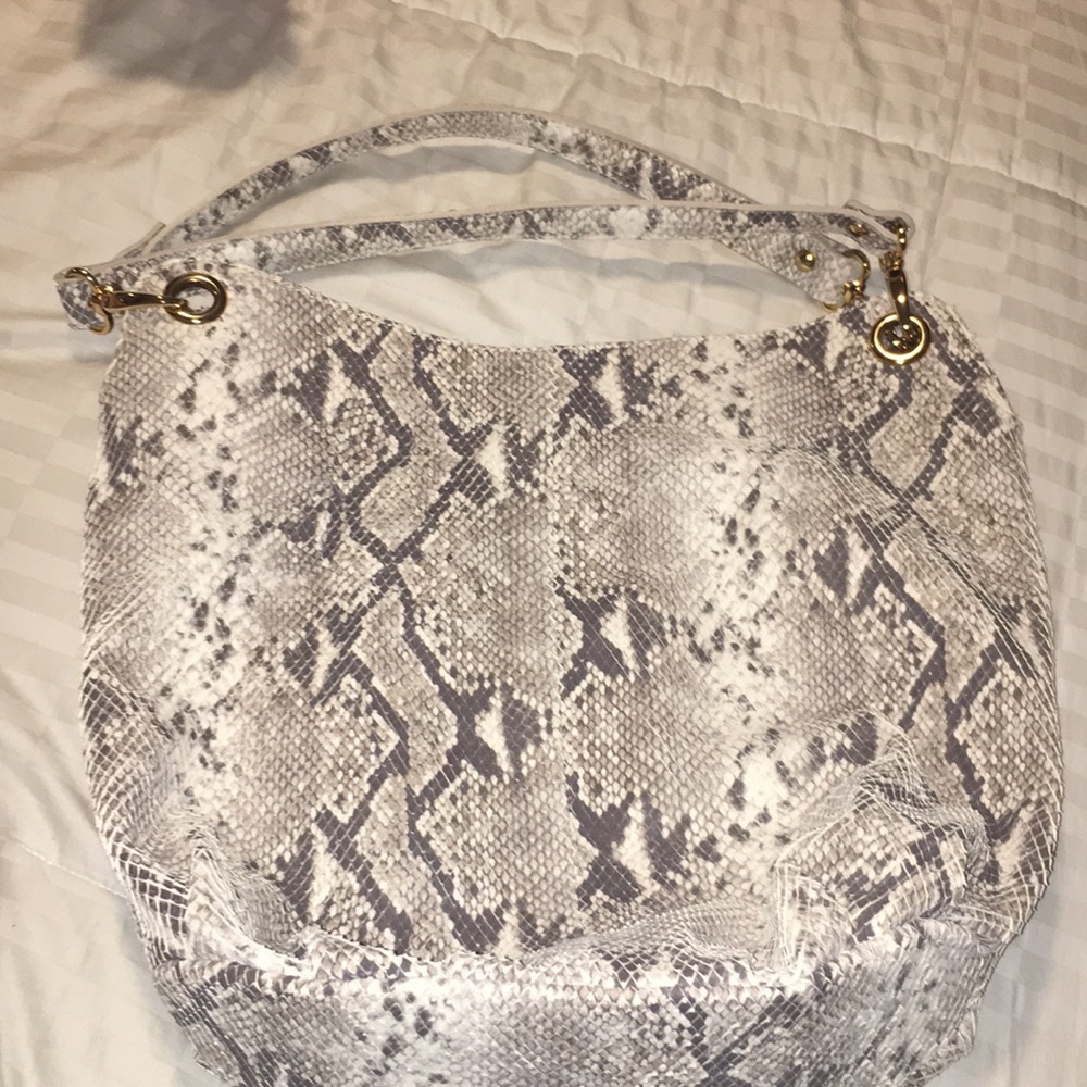 Maurizio taiuti unfinished python bag